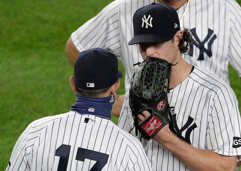 An upset Gerrit Cole has some words for Aaron Boone after getting pulled in the seventh inning of the Yankee's 4-2 loss to the Rays on Wednesday night.