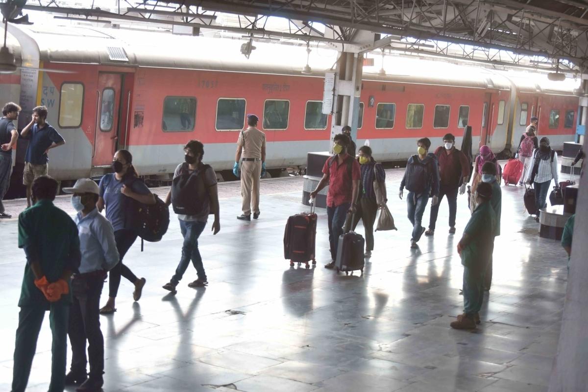 People stranded in Hyderabad due to the ongoing nationwide lockdown imposed to mitigate the spread of coronavirus, arrive at Secunderabad Junction railway station to board special trains being run by the Indian Railways to return to their respective nativ